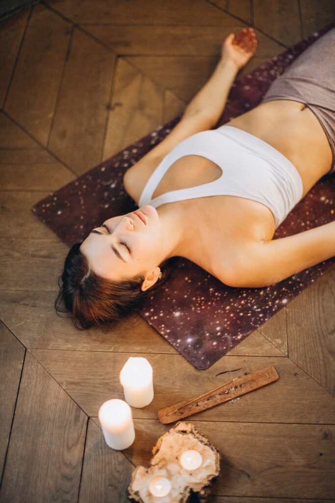 woman lying down in savasana