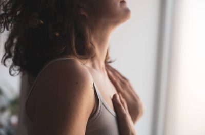 Woman hands touching her body close up, Embodiment, Feldenkrais Method and Awareness through movement