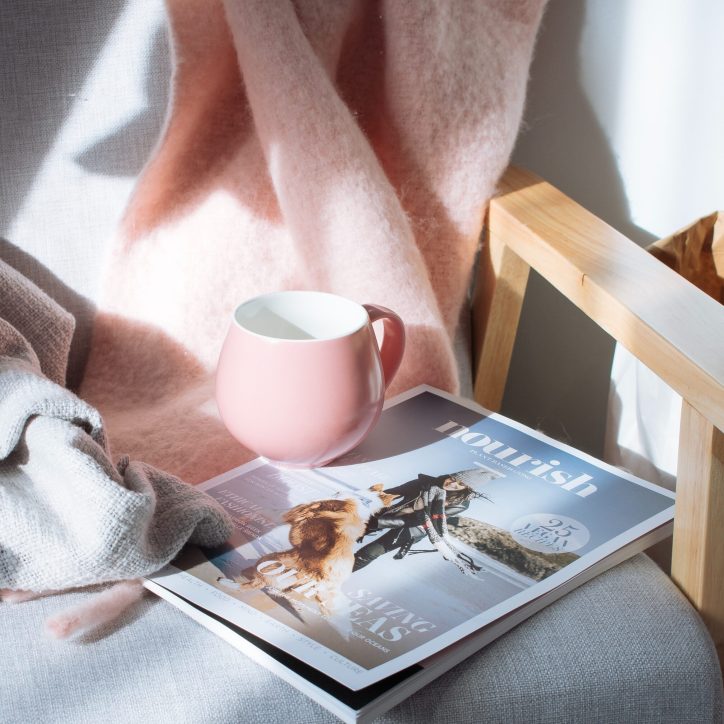 cozy chair with blanket and mug