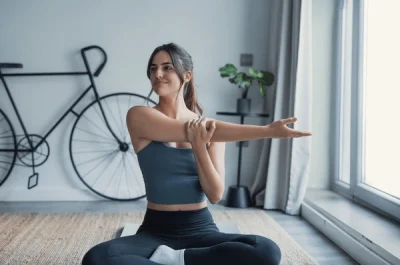woman-stretches-her-arms-600nw-2750700489